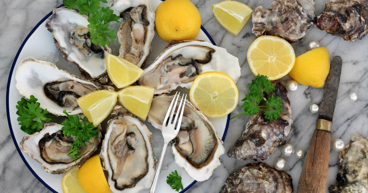 Image illustrating flavorful shucked oysters with lemon juice.