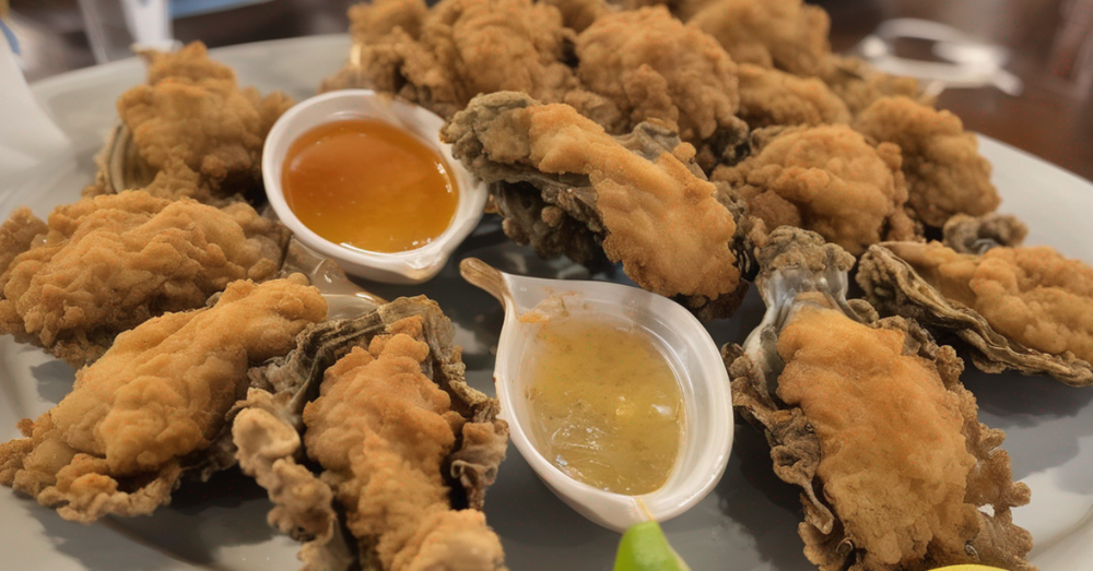 Image illustrating the flavorful Mediterranean Seafood dish of fried oysters with various pairings.