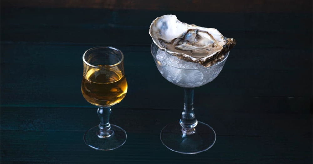 Image illustrating a unique pairing of whiskey and oysters.
